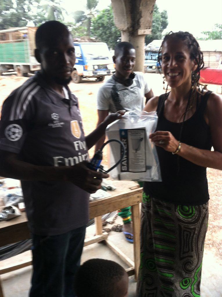 Vice President Michal Anna Carrillo distributing a waves for water clean water filter!
